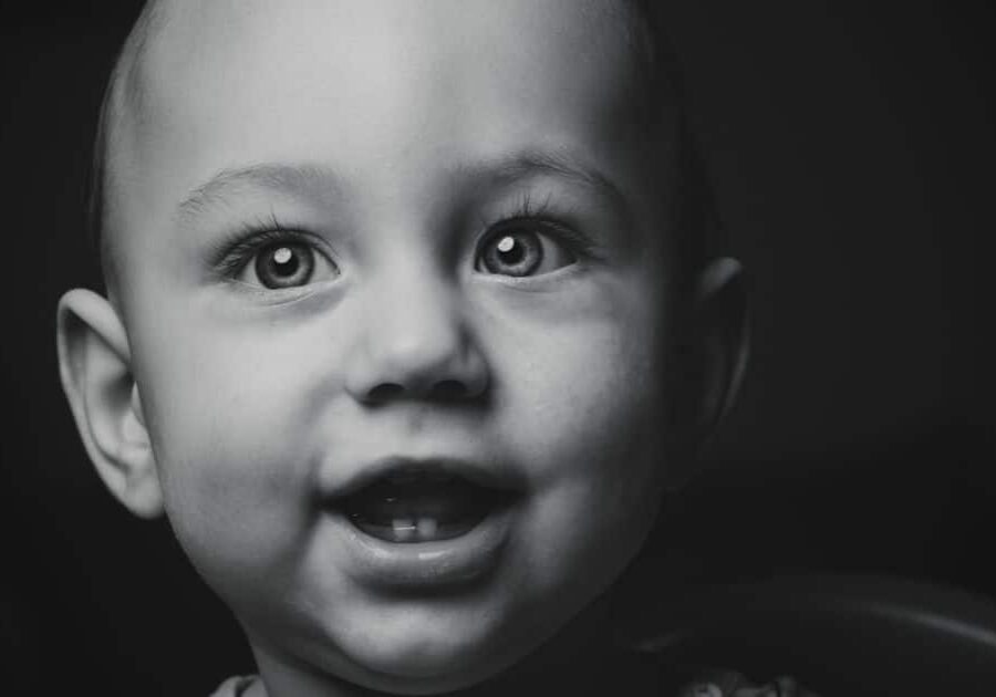 Teething baby in black and white photo