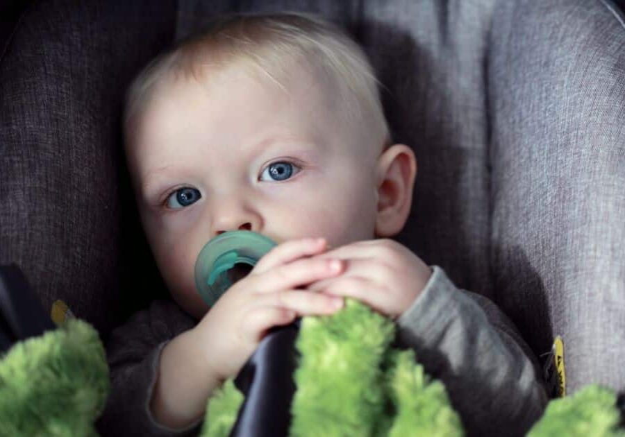 Useful car seat tips with baby in car seat using pacifier