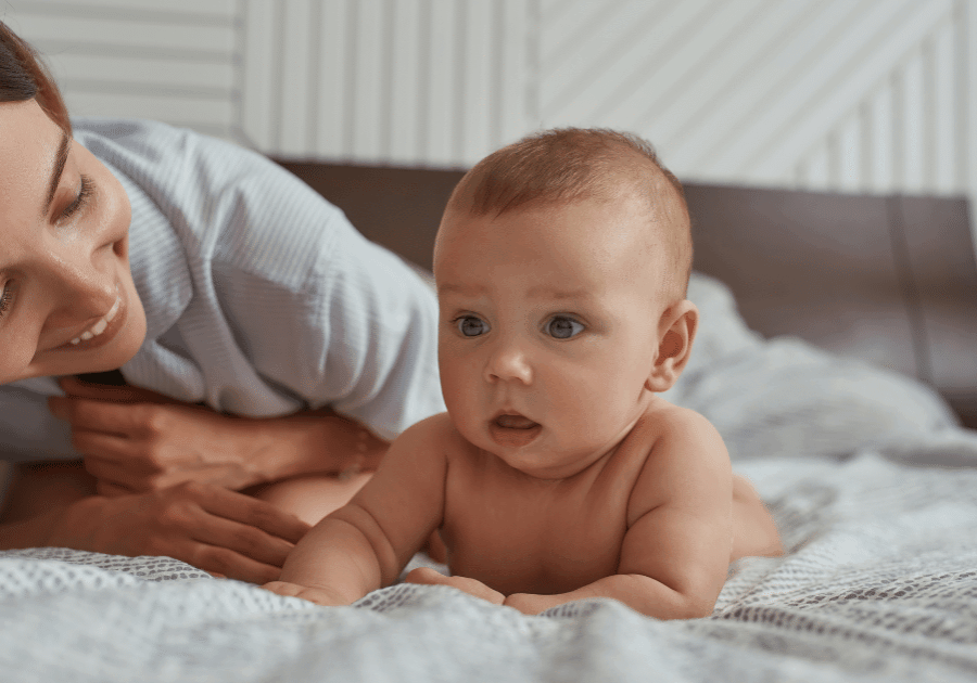 Day doulas are alongside you to answer questions and support baby's care -- like tummy time!